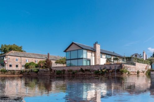 Ferryside Bespoke Home next to River.